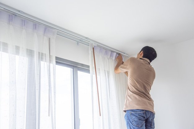 Young Man Installing Blind Curtains Window Renovate Inside House 73740 428 