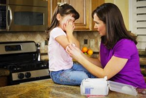 How do I teach my child basic first aid?