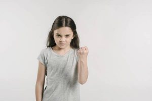 Why does the child become angry and aggressive?