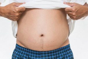 What causes an abdominal hernia, and how should it be treated?