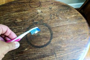 Methods for removing water stains from wooden surfaces