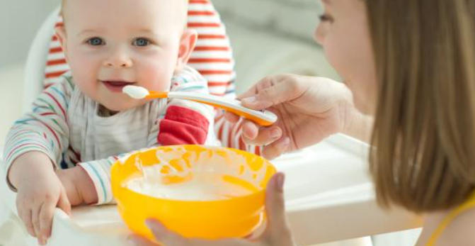 In the sixth month, what is the baby's food?